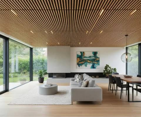 Warm wood-effect baffle ceiling in a contemporary interior