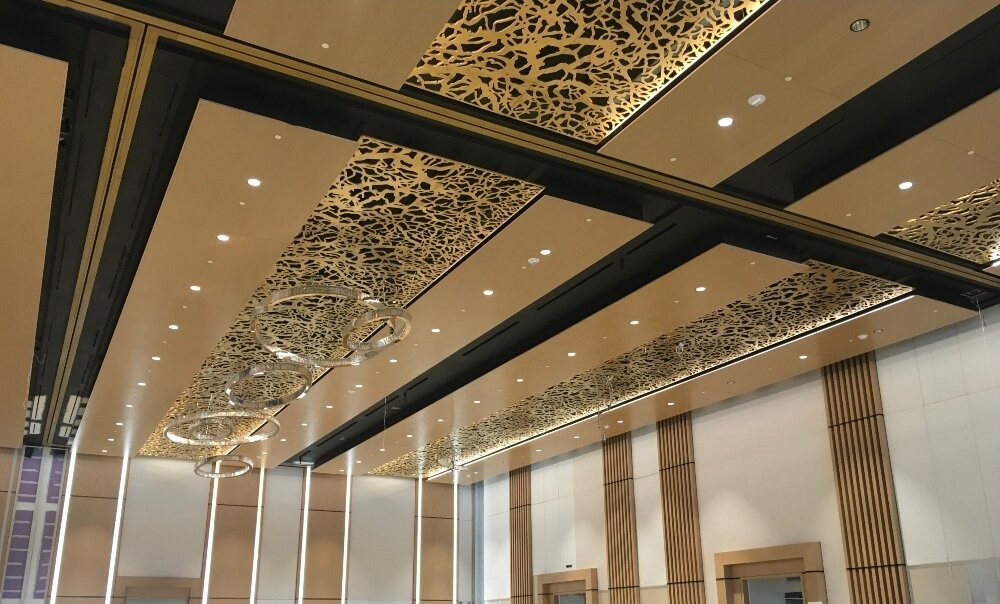 Branch-pattern laser-cut ceiling — wider application view