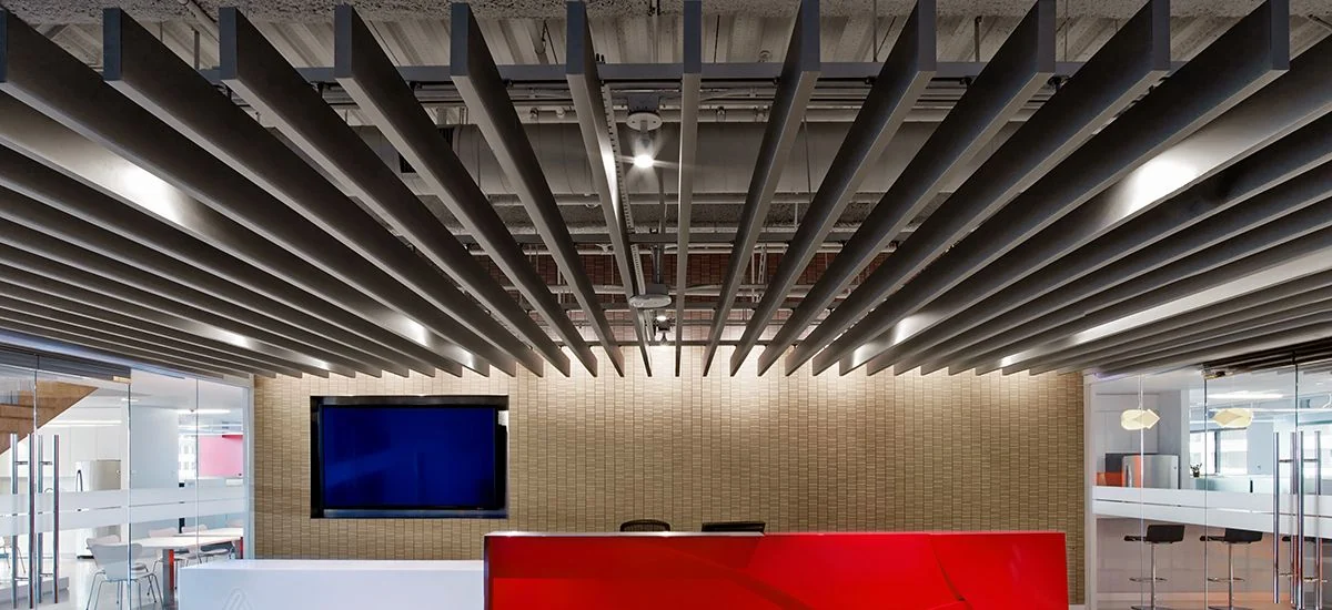 Dark aluminium baffles, Avery Dennison office — Hunter Douglas